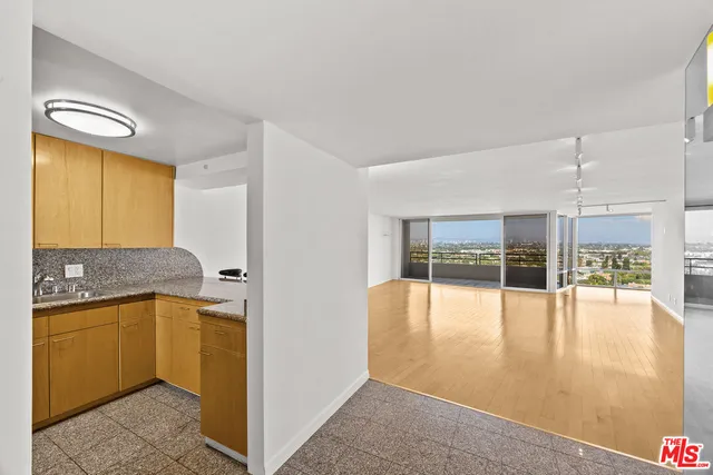 a kitchen that has a sink and a microwave