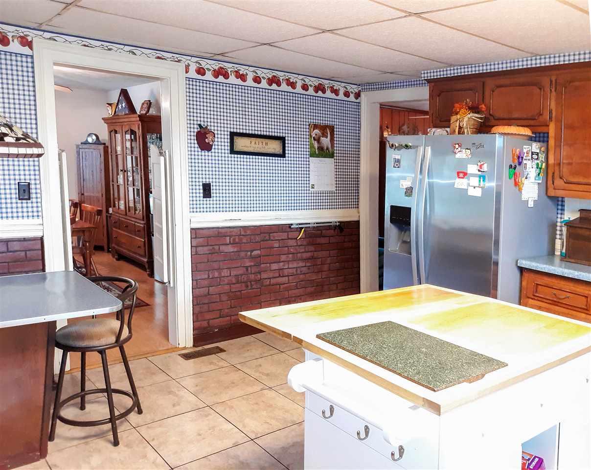 514 Oak Hill Road Staunton, VA 24401 - Photo 18 of 43 a kitchen with stainless steel appliances kitchen island a refrigerator and a stove