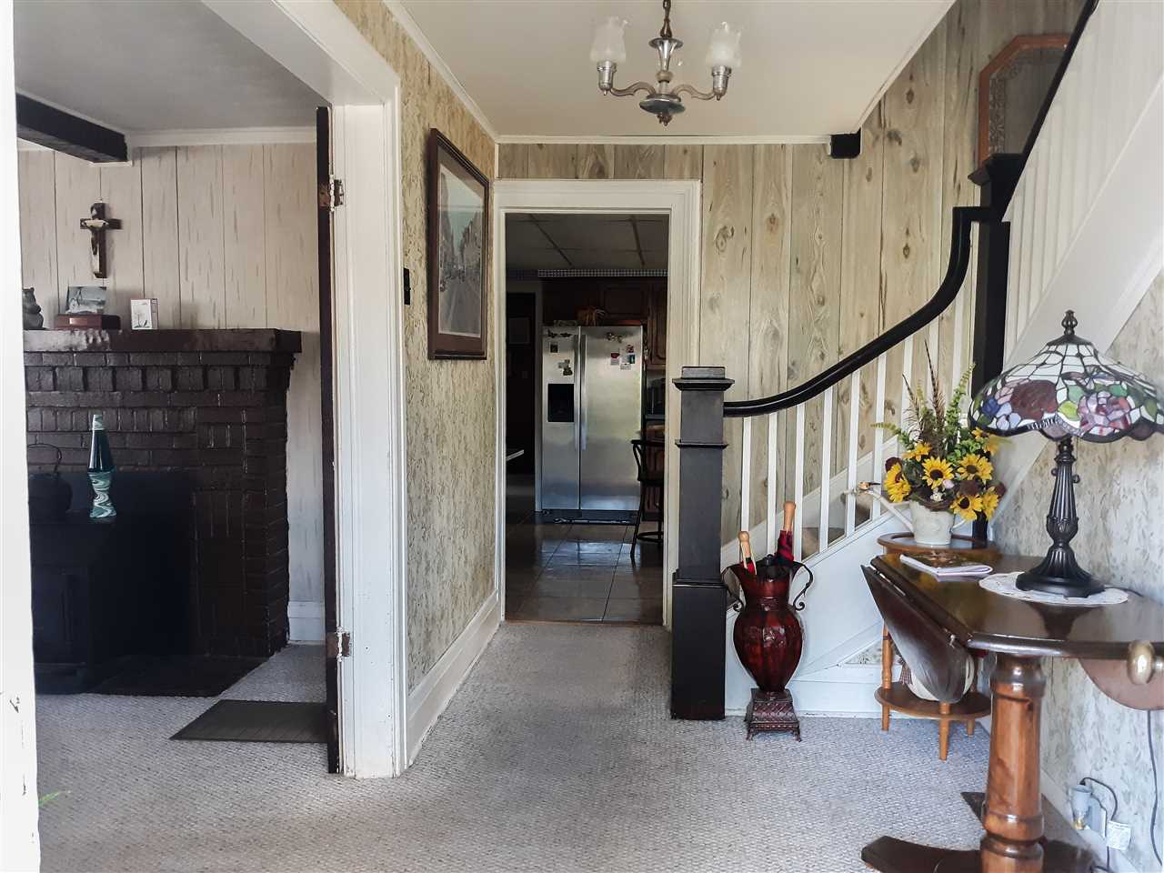 514 Oak Hill Road Staunton, VA 24401 - Photo 5 of 43 a view of a hallway with dining room and chandelier