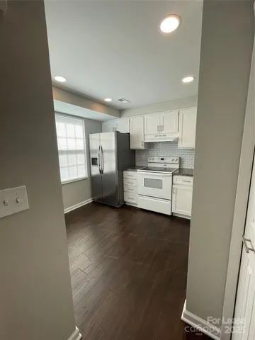 a view of a kitchen with a sink cabinets and a window