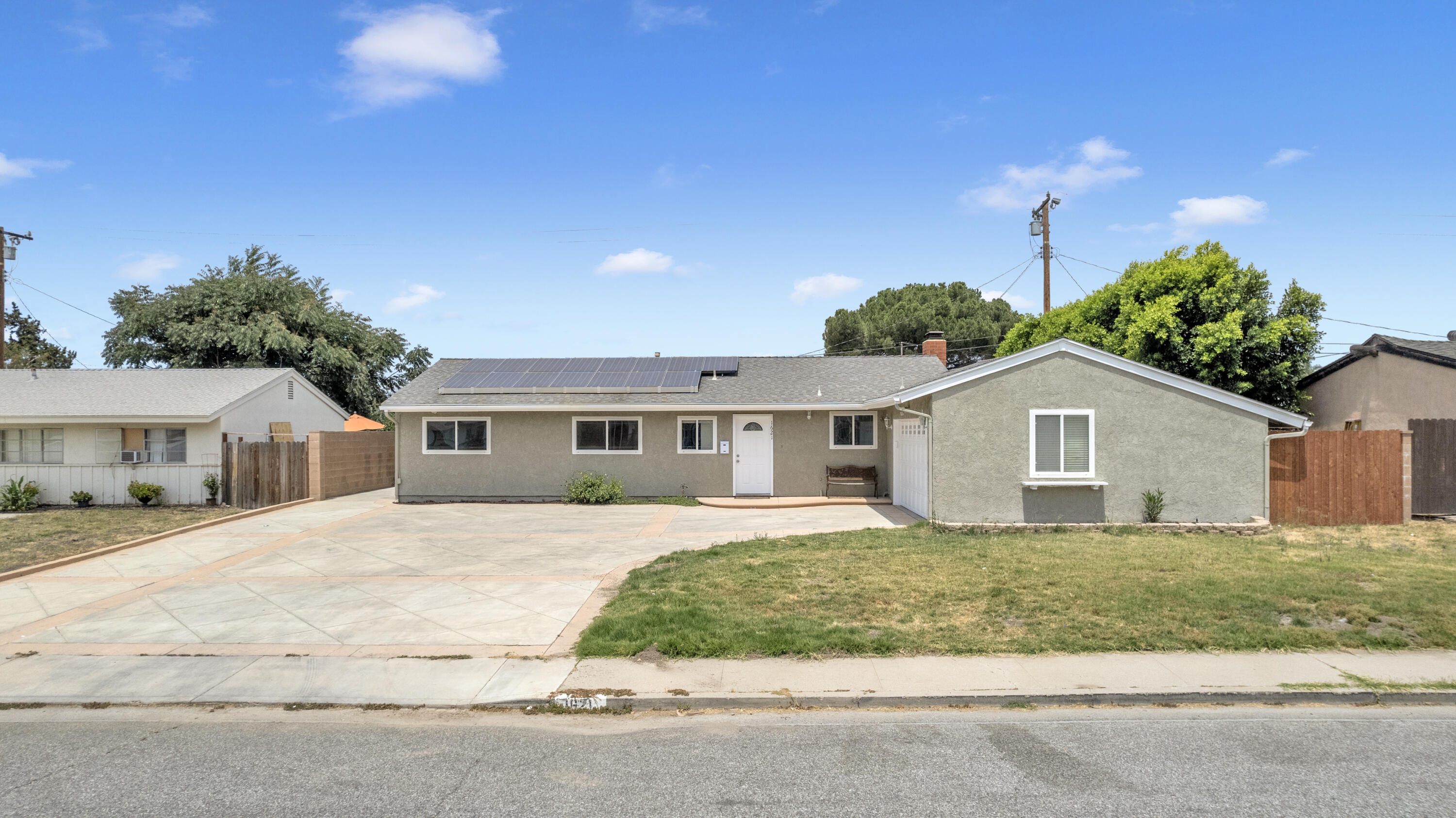 1621 Arcane Street Simi Valley, CA 93065 - Photo 2 of 63 a front view of a house with a yard and garage