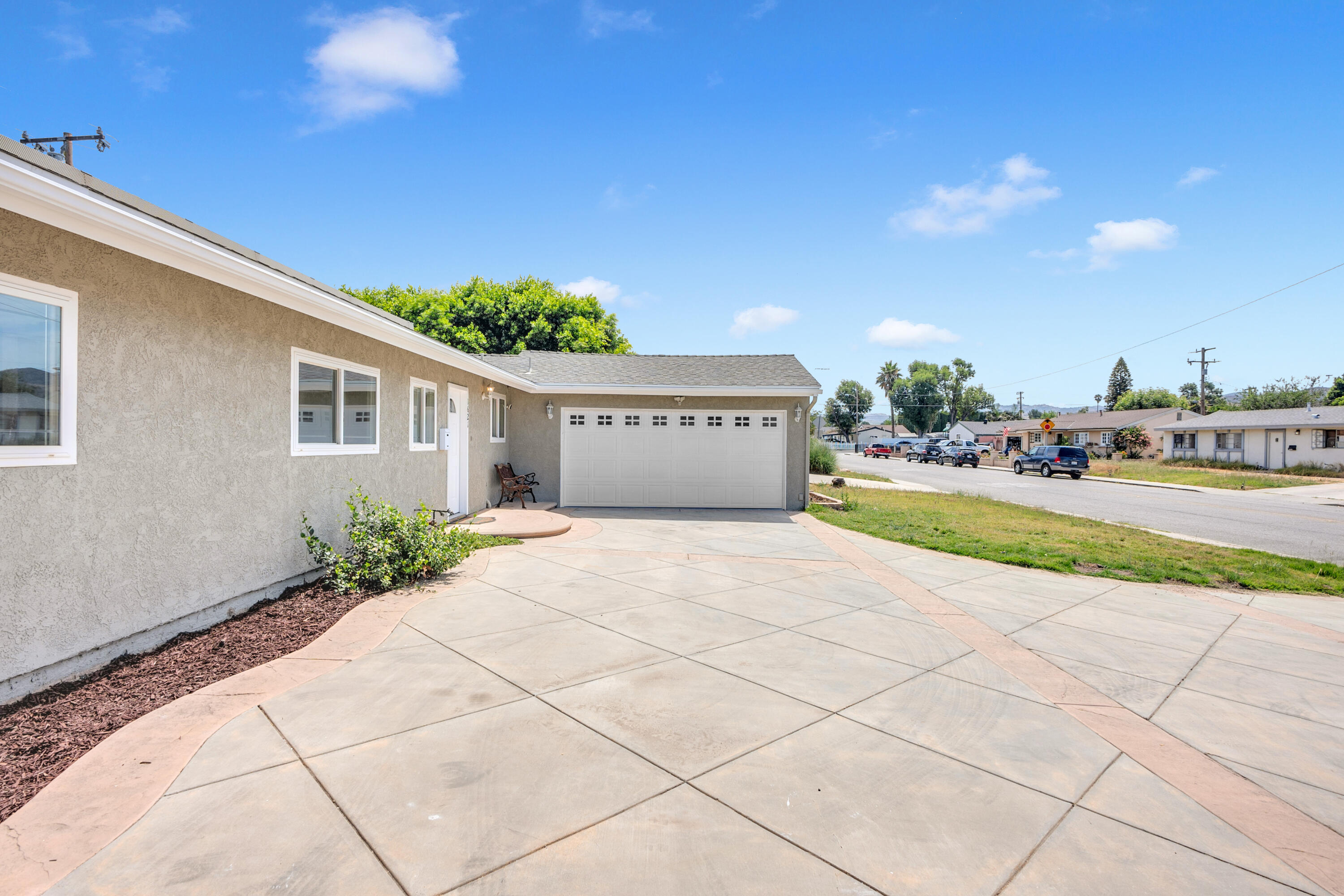 1621 Arcane Street Simi Valley, CA 93065 - Photo 56 of 63 a front view of a house with a yard and potted plants