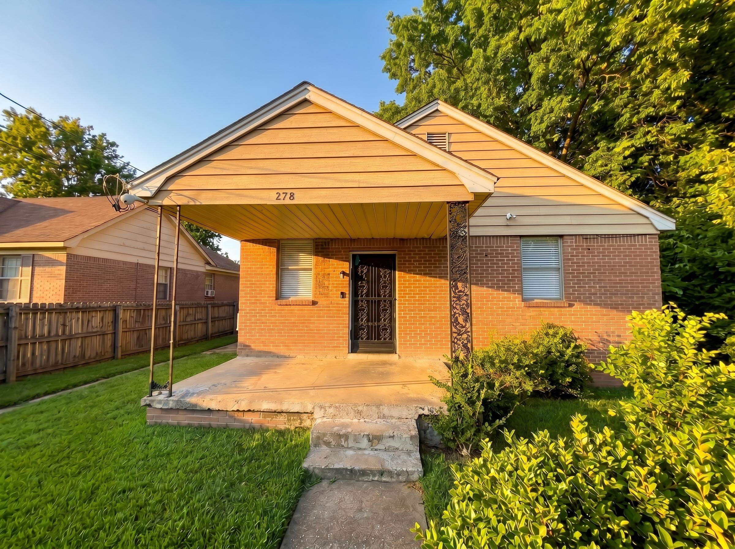 278 Hewlett Road Memphis, TN 38109 - Photo 1 of 5 Brick exterior with horizontal siding accents, covered front porch, and security door