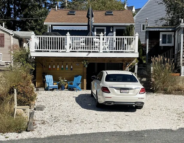a view of a car park in front of house