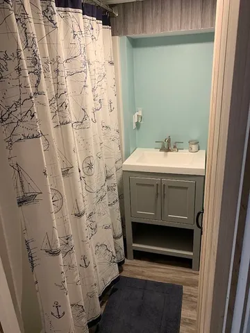 a bathroom with a sink and mirror