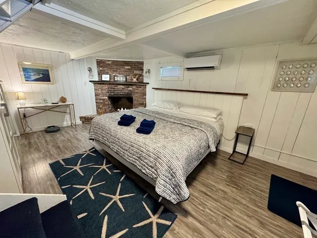 a bedroom with a bed and a table in it