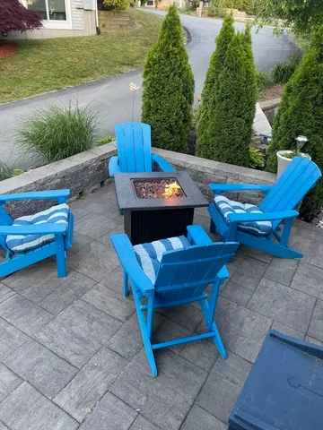 a view of a backyard with sitting area
