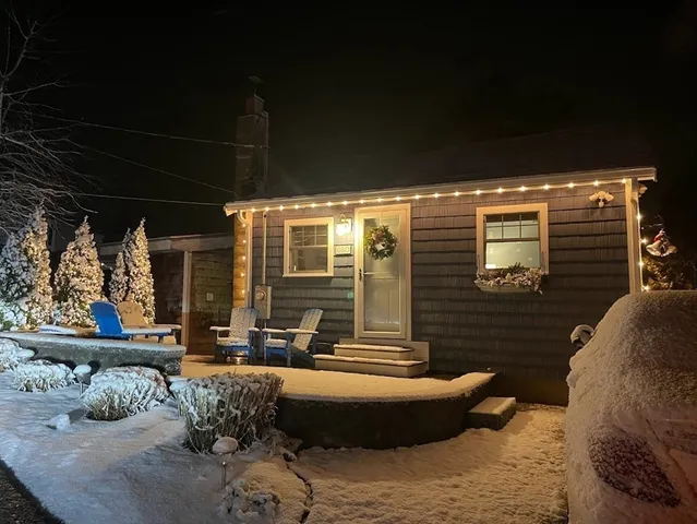 a view of a patio with couches chairs and potted plants