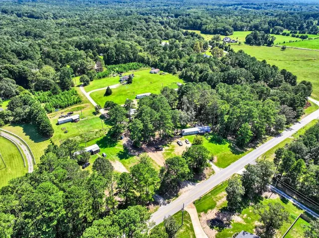 a view of a swimming pool with a garden