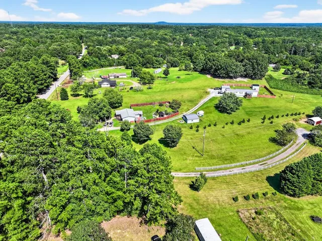 a aerial view of a house with a yard