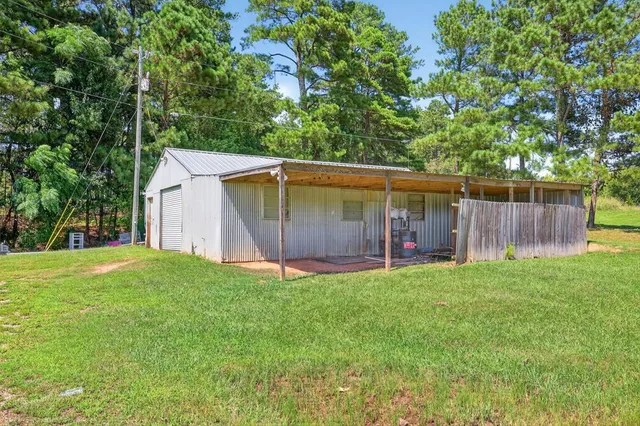 a front view of house with yard and outdoor seating