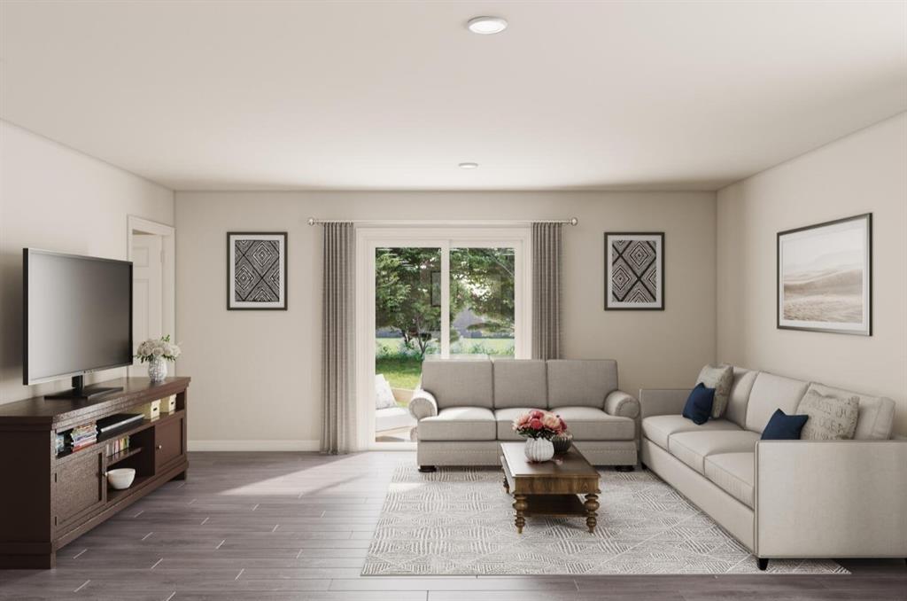 309 Victory Drive Mabank, TX 75147 - Photo 12 of 37 a living room with furniture and a flat screen tv