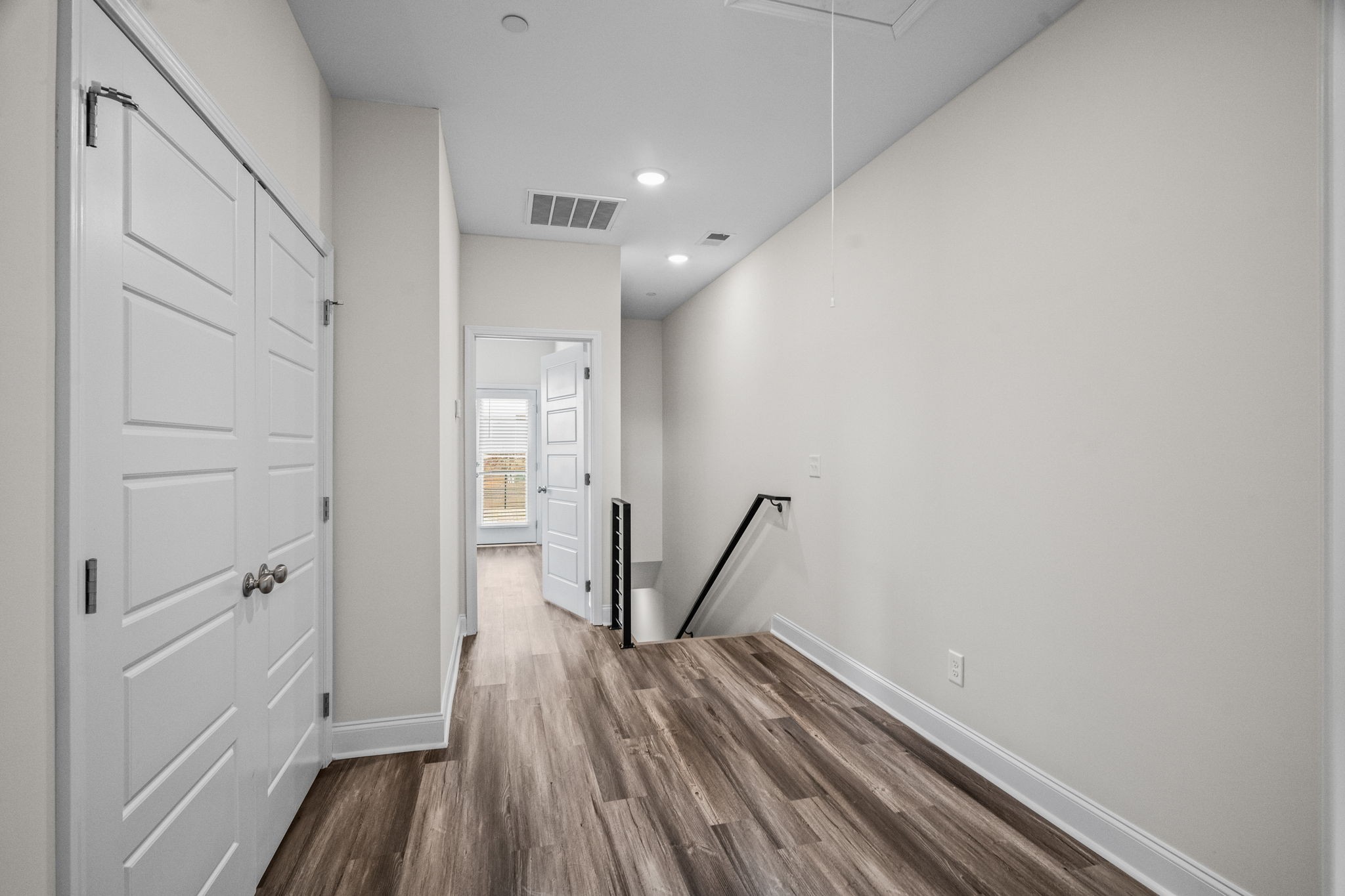 214 Franklin Street Pleasant View, TN 37146 - Photo 13 of 30 a view of a hallway with wooden floor and staircase