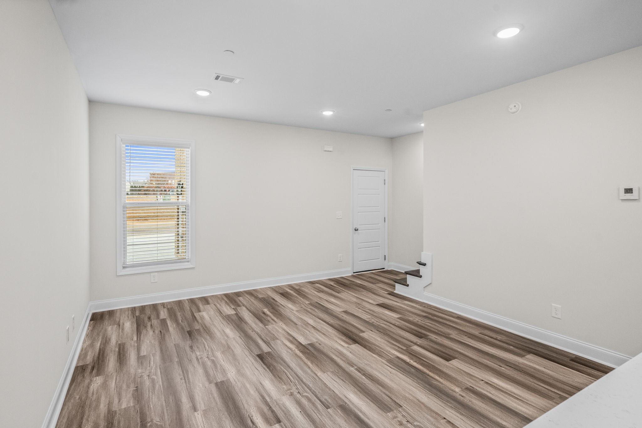 214 Franklin Street Pleasant View, TN 37146 - Photo 17 of 30 a view of room with window and hardwood floor