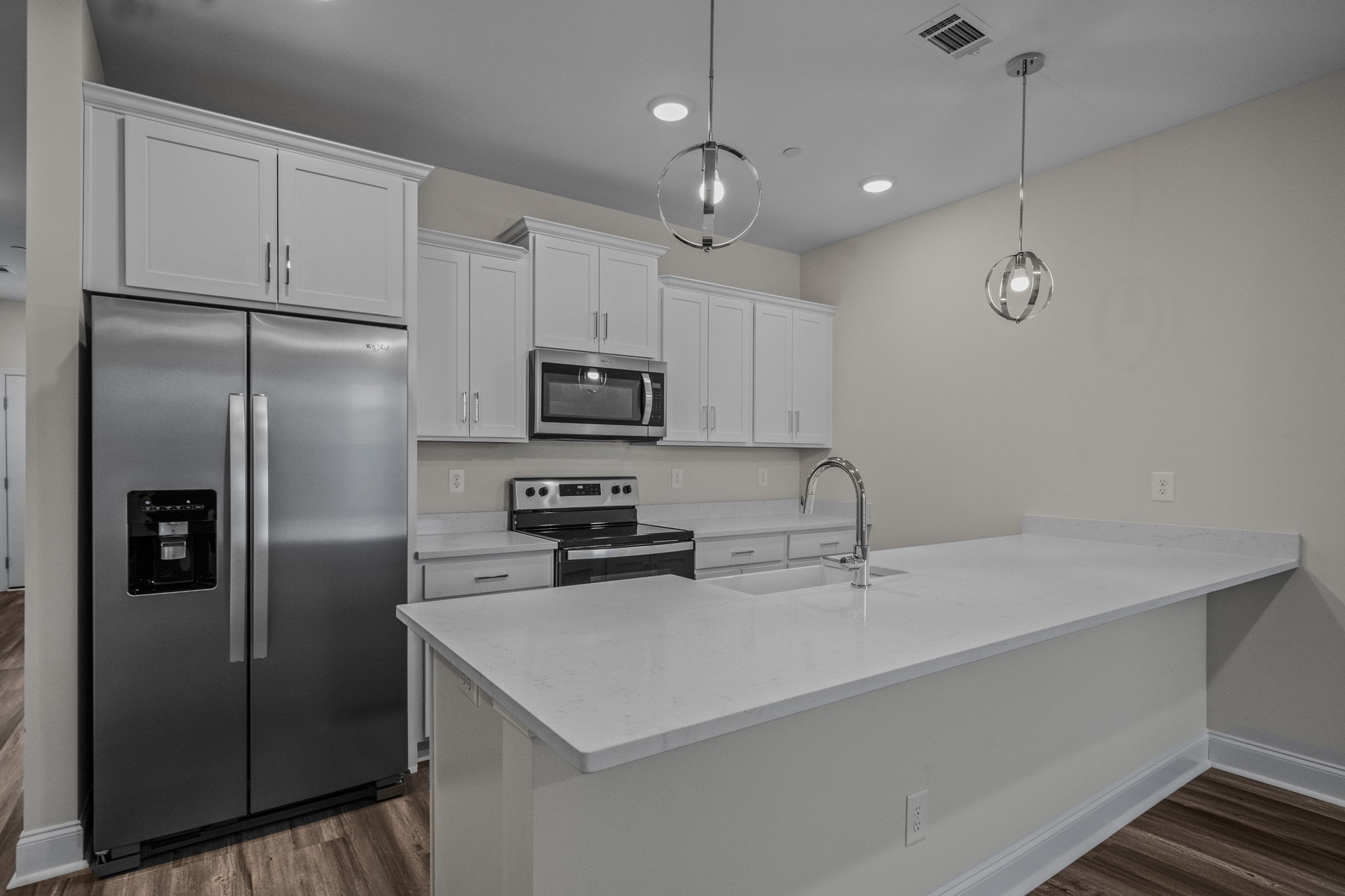 214 Franklin Street Pleasant View, TN 37146 - Photo 20 of 30 a kitchen with stainless steel appliances a refrigerator sink and microwave