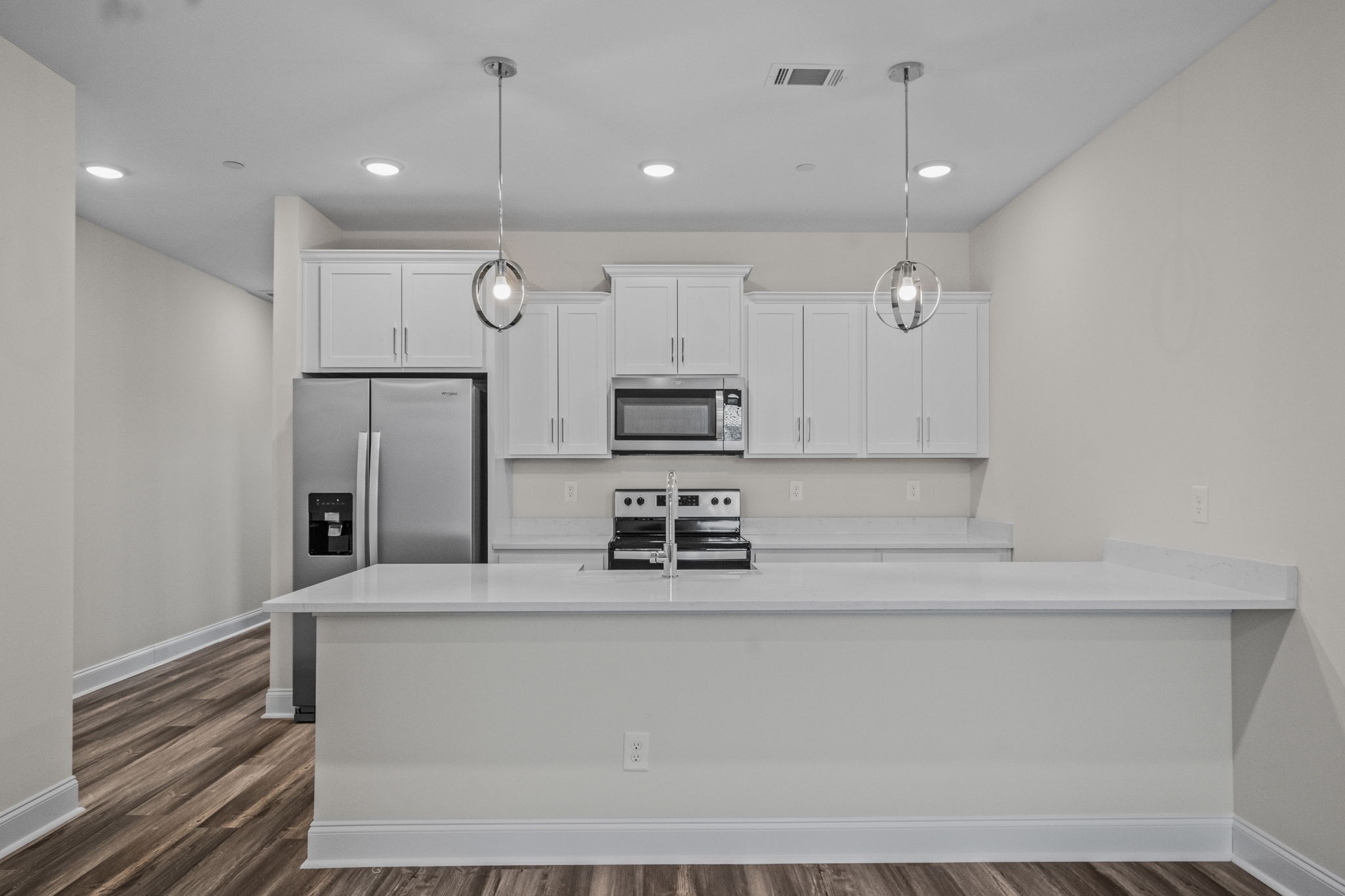 214 Franklin Street Pleasant View, TN 37146 - Photo 21 of 30 a kitchen with kitchen island a counter top space stainless steel appliances and cabinets