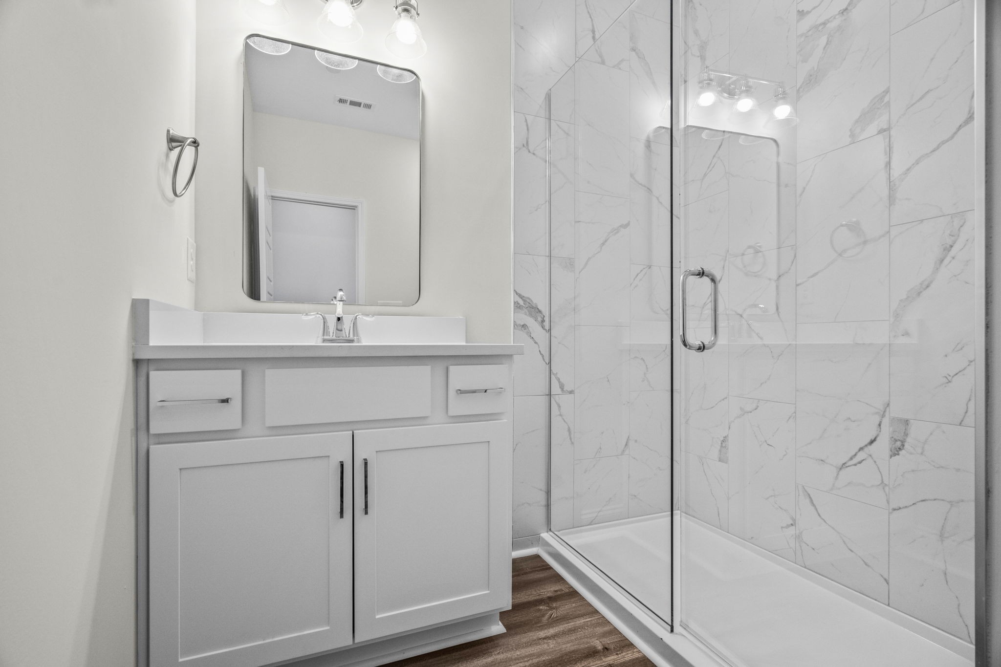 214 Franklin Street Pleasant View, TN 37146 - Photo 23 of 30 a bathroom with a shower sink and mirror