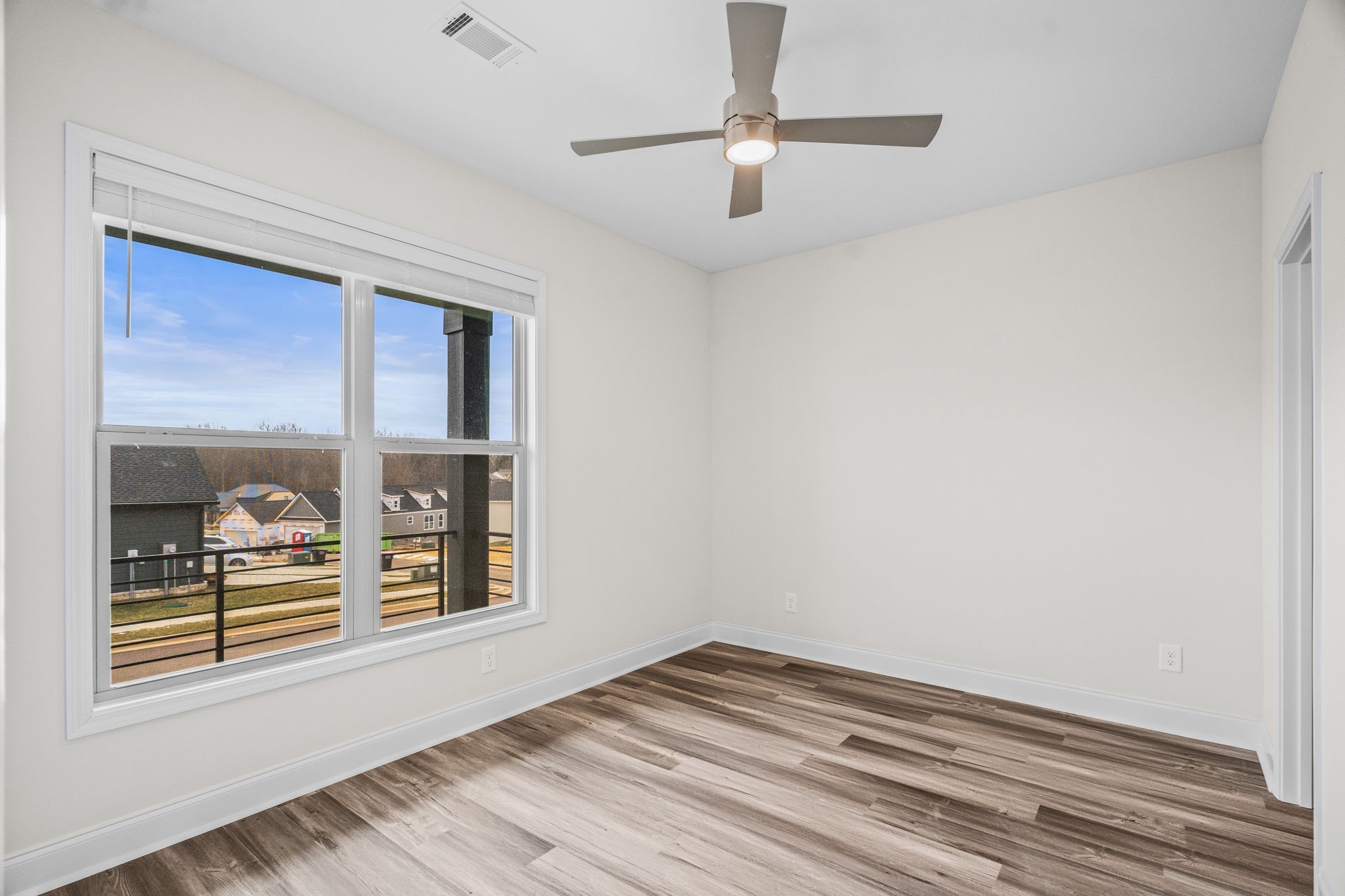 214 Franklin Street Pleasant View, TN 37146 - Photo 26 of 30 an empty room with wooden floor closet and windows