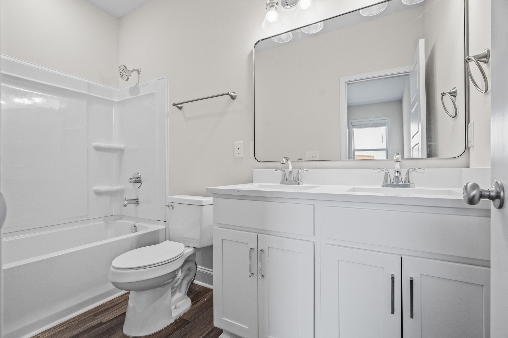 214 Franklin Street Pleasant View, TN 37146 - Photo 6 of 30 a bathroom with a toilet a sink a mirror a bathtub and vanity