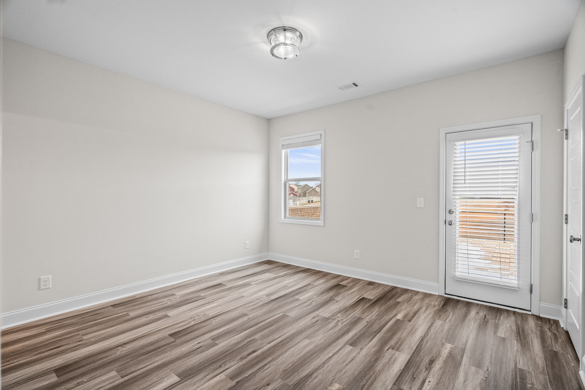 214 Franklin Street Pleasant View, TN 37146 - Photo 8 of 30 wooden floor in an empty room with a window