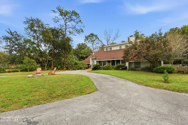a view of a dining room with lots of furniture and wooden floor