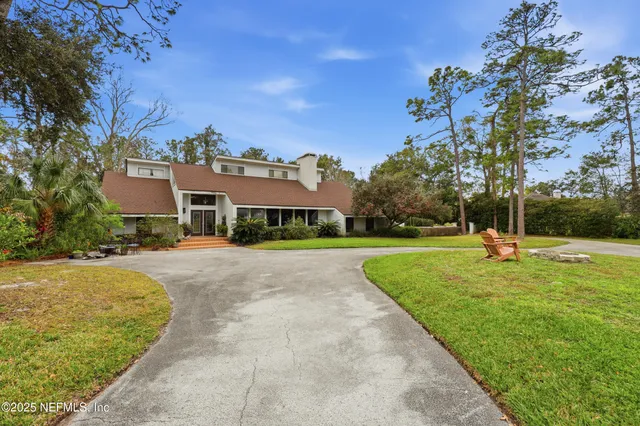 a dining space with furniture and city view