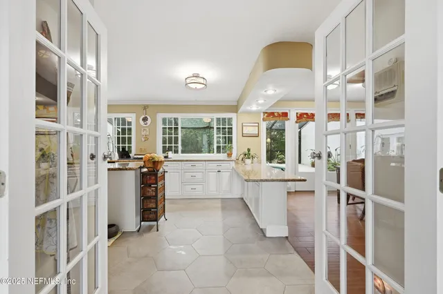 a kitchen with stainless steel appliances granite countertop a sink stove and cabinets