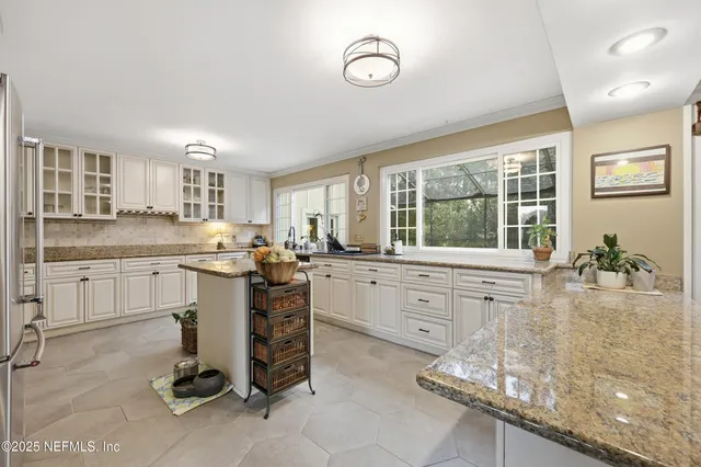 a view of a livingroom with furniture window and wooden floor