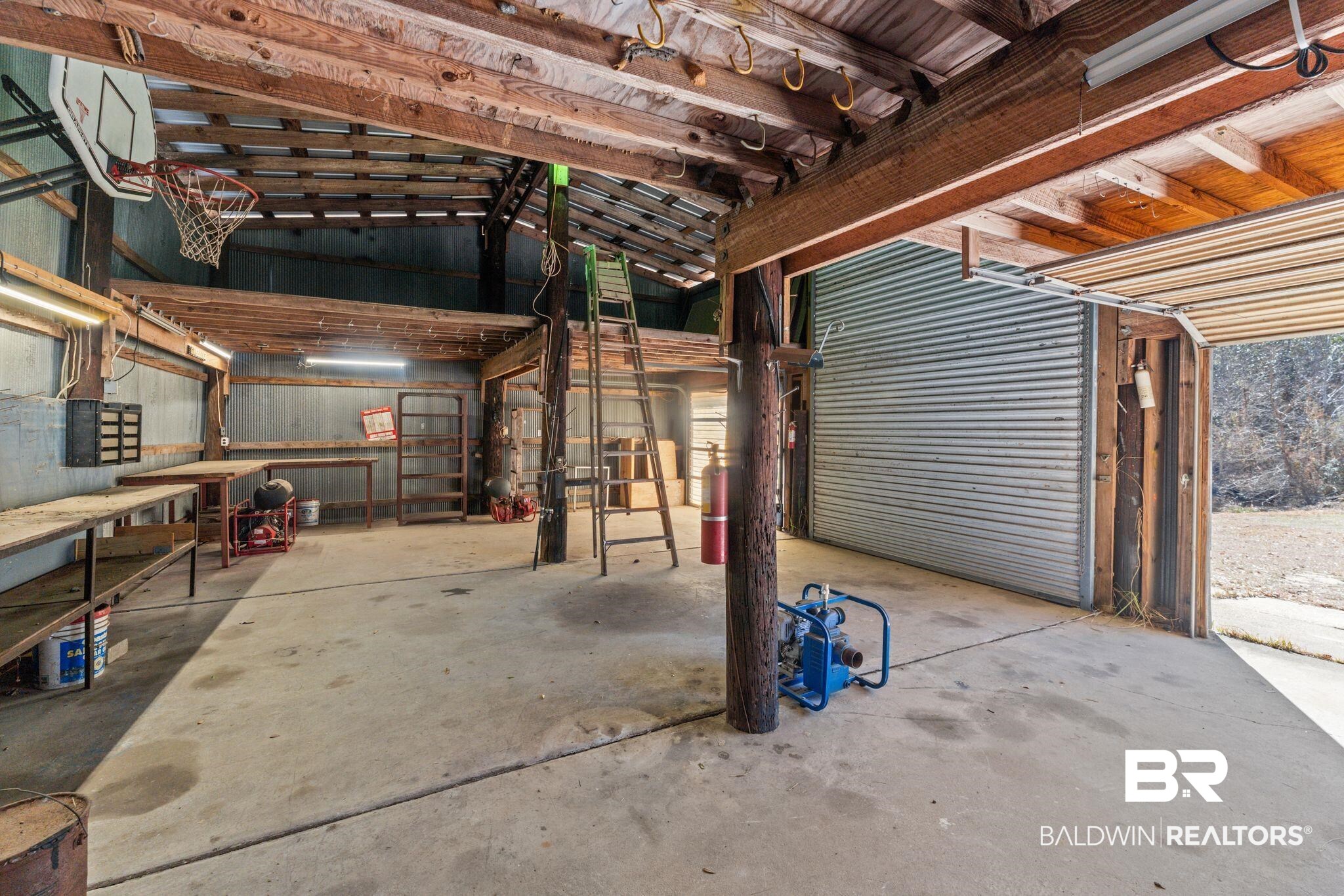 32989 Antietam Road Lillian, AL 36549 - Photo 34 of 56 Miscellaneous room with unfinished concrete floors and lofted ceiling
