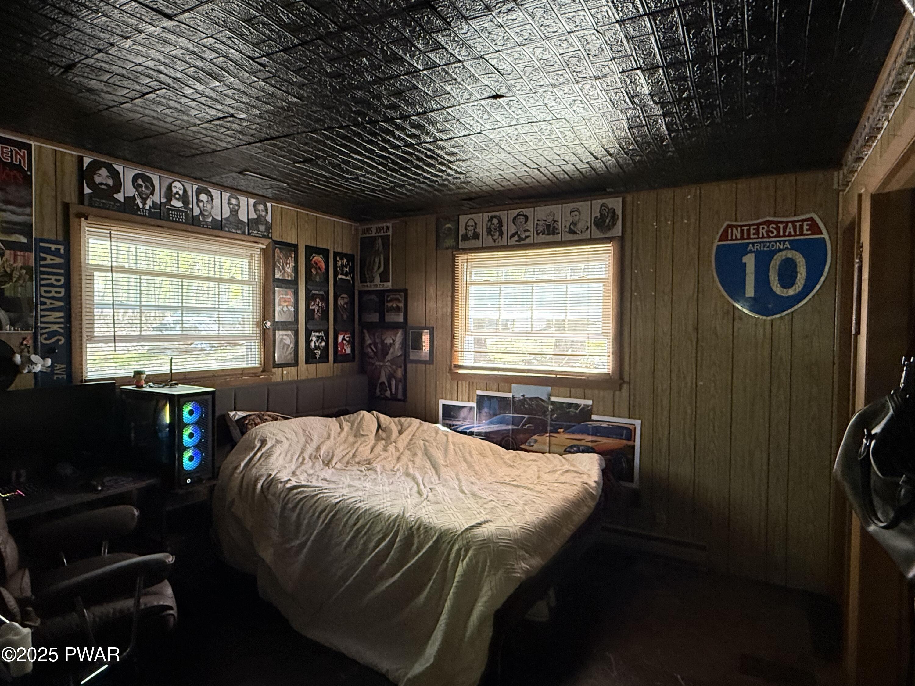 103 Stonehenge Road Milford, PA 18337 - Photo 7 of 20 a bed sitting in a spacious bedroom next to a window