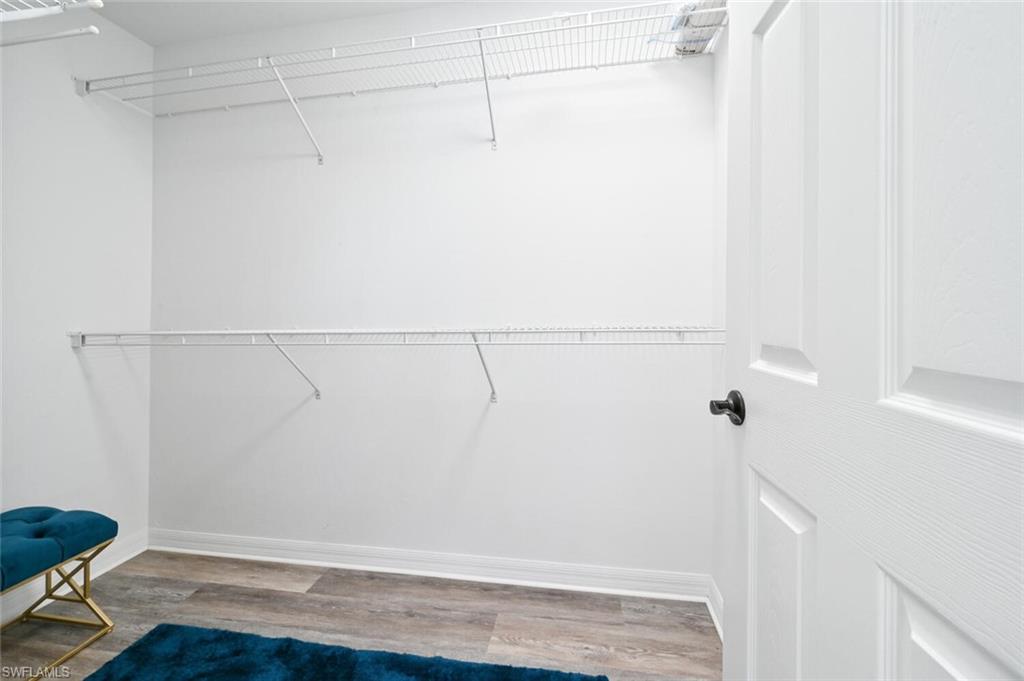 981 Hampton Circle, Unit 119 Naples, FL 34105 - Photo 17 of 30 a view of small space with racks on the wall