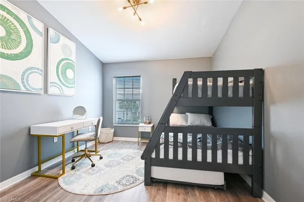 a bedroom with a bed and a table