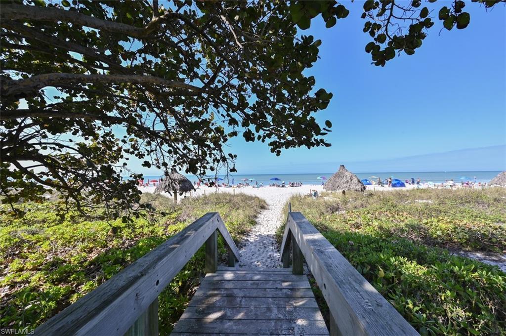 981 Hampton Circle, Unit 119 Naples, FL 34105 - Photo 28 of 30 a view of a yard with wooden fence