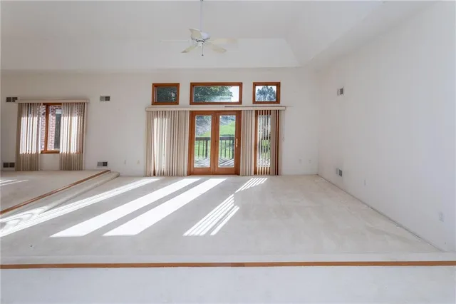 a view of empty room with windows