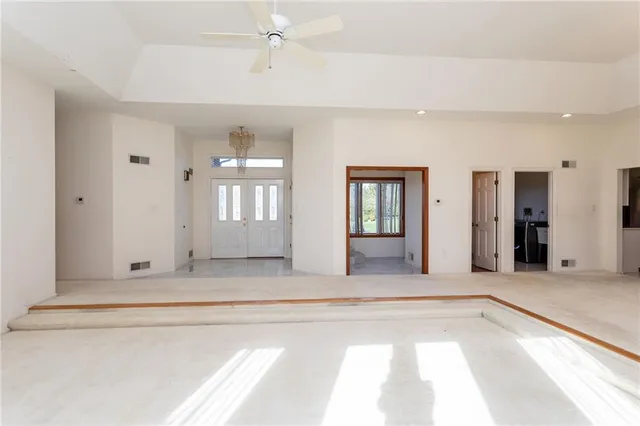 a view of an entryway with wooden floor and cabinet