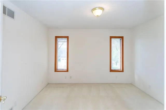 an empty room with windows