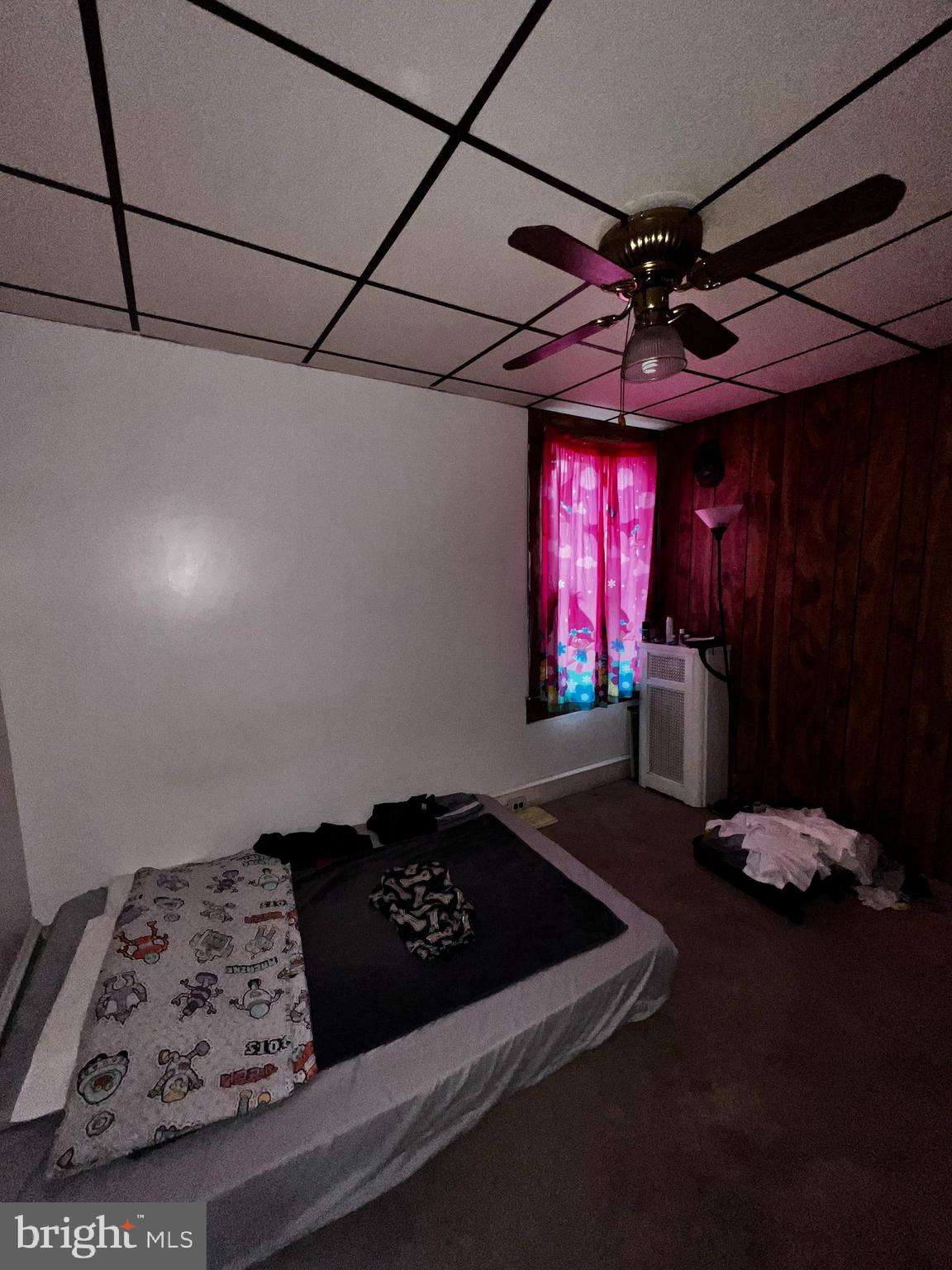 7146 Marsden Street Philadelphia, PA 19135 - Photo 12 of 22 a bedroom with a bed and a mirror