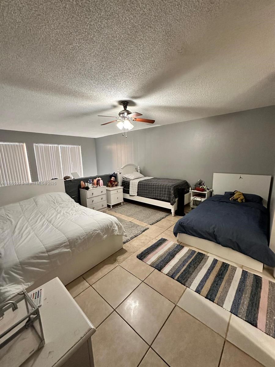 17911 Northwest 68th Avenue, Unit N207 Hialeah, FL 33015 - Photo 13 of 18 a living room with furniture