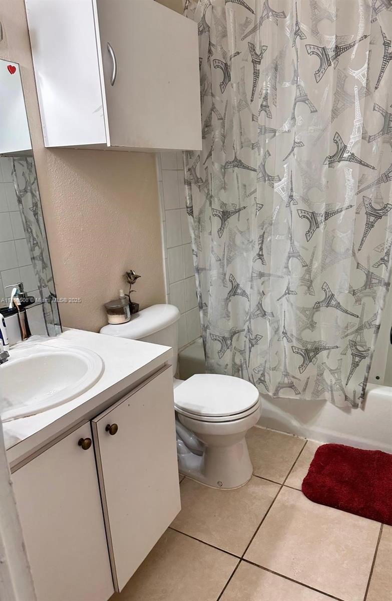 17911 Northwest 68th Avenue, Unit N207 Hialeah, FL 33015 - Photo 14 of 18 a bathroom with a sink and a toilet