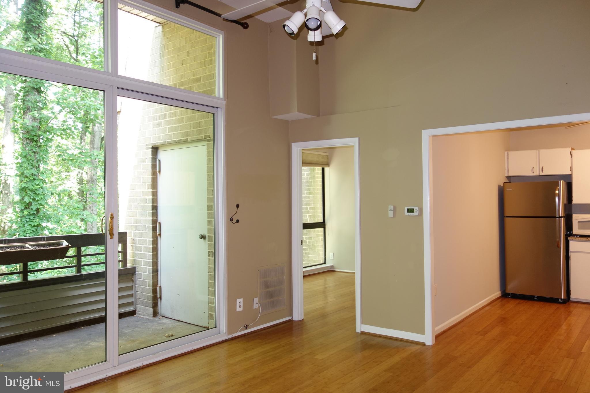2114 Green Watch Way, Unit 301 Reston, VA 20191 - Photo 3 of 34 Soaring floor to ceiling windows through out