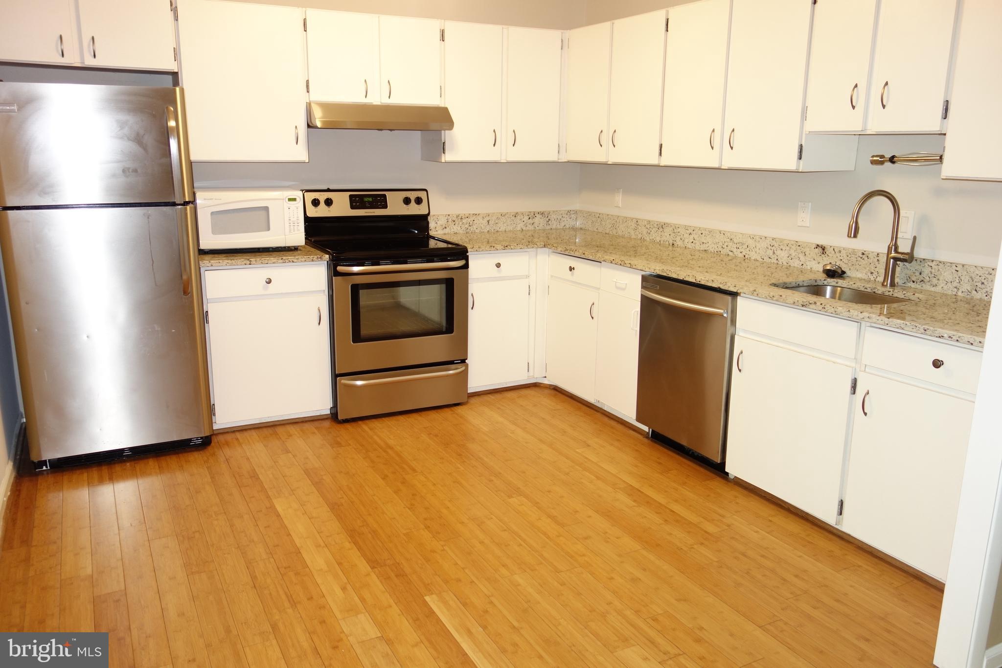 2114 Green Watch Way, Unit 301 Reston, VA 20191 - Photo 9 of 34 Kitchen with granite and stainless appliances