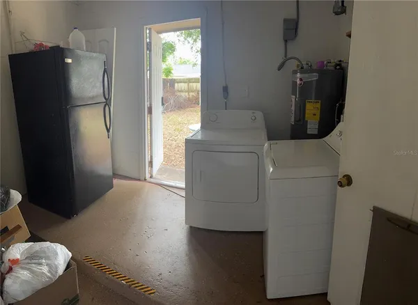 a utility room with dryer and washer