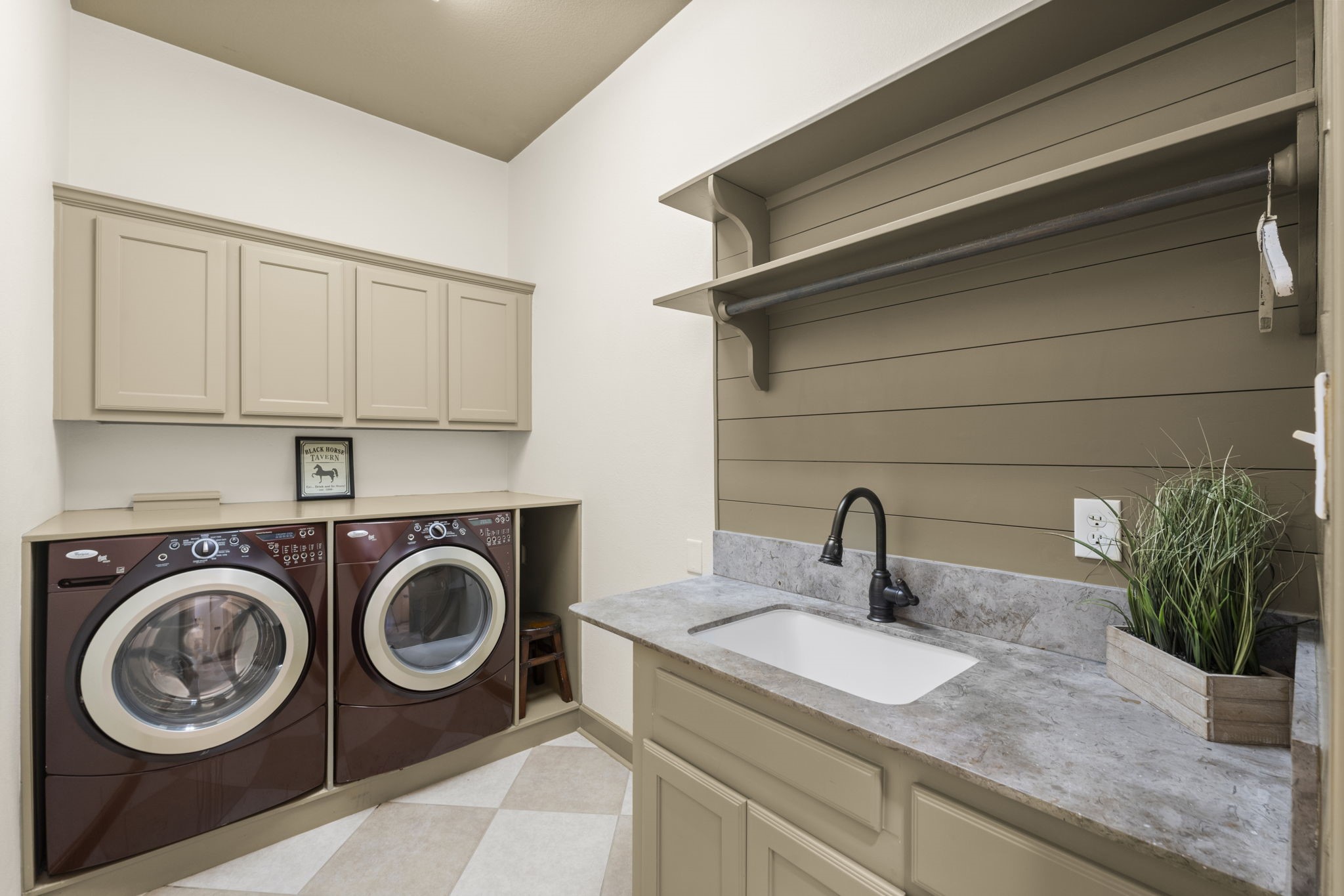 1534 Virgie Community Road Magnolia, TX 77354 - Photo 32 of 50 A beautiful utility room with sink and hanging rod. The washer and dryer convey with the home.