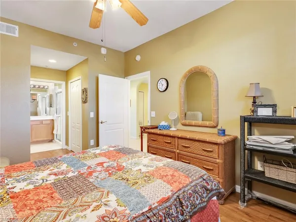 a bedroom with a bed and a dresser