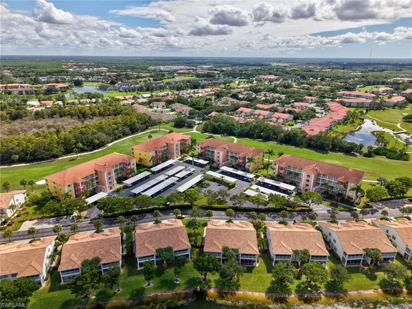 an aerial view of residential houses and outdoor space