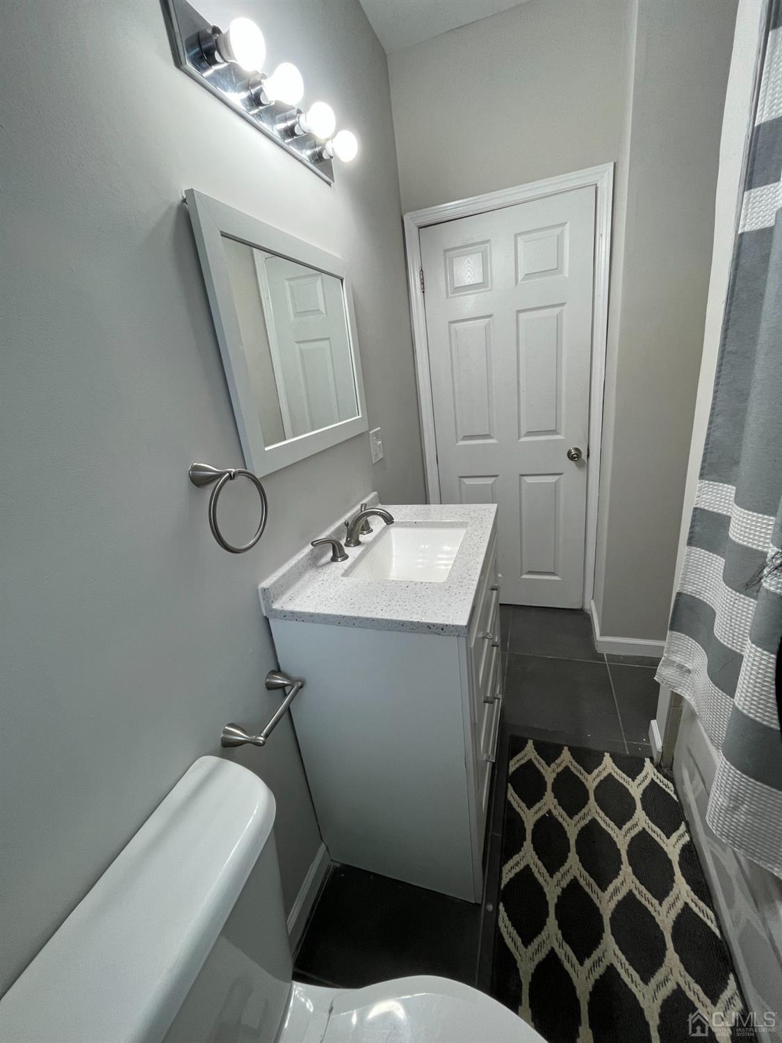 37 Thomas Street Perth Amboy, NJ 08861 - Photo 17 of 30 a bathroom with a sink toilet and shower