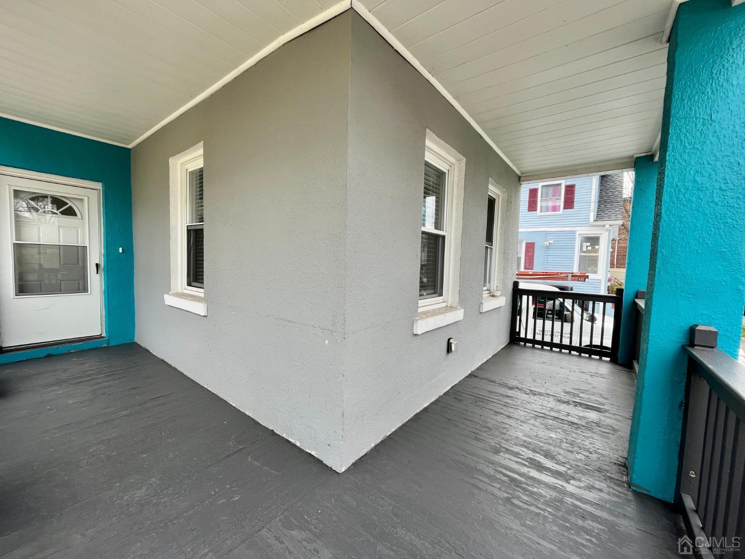 37 Thomas Street Perth Amboy, NJ 08861 - Photo 21 of 30 a view of a big room with wooden floor and windows