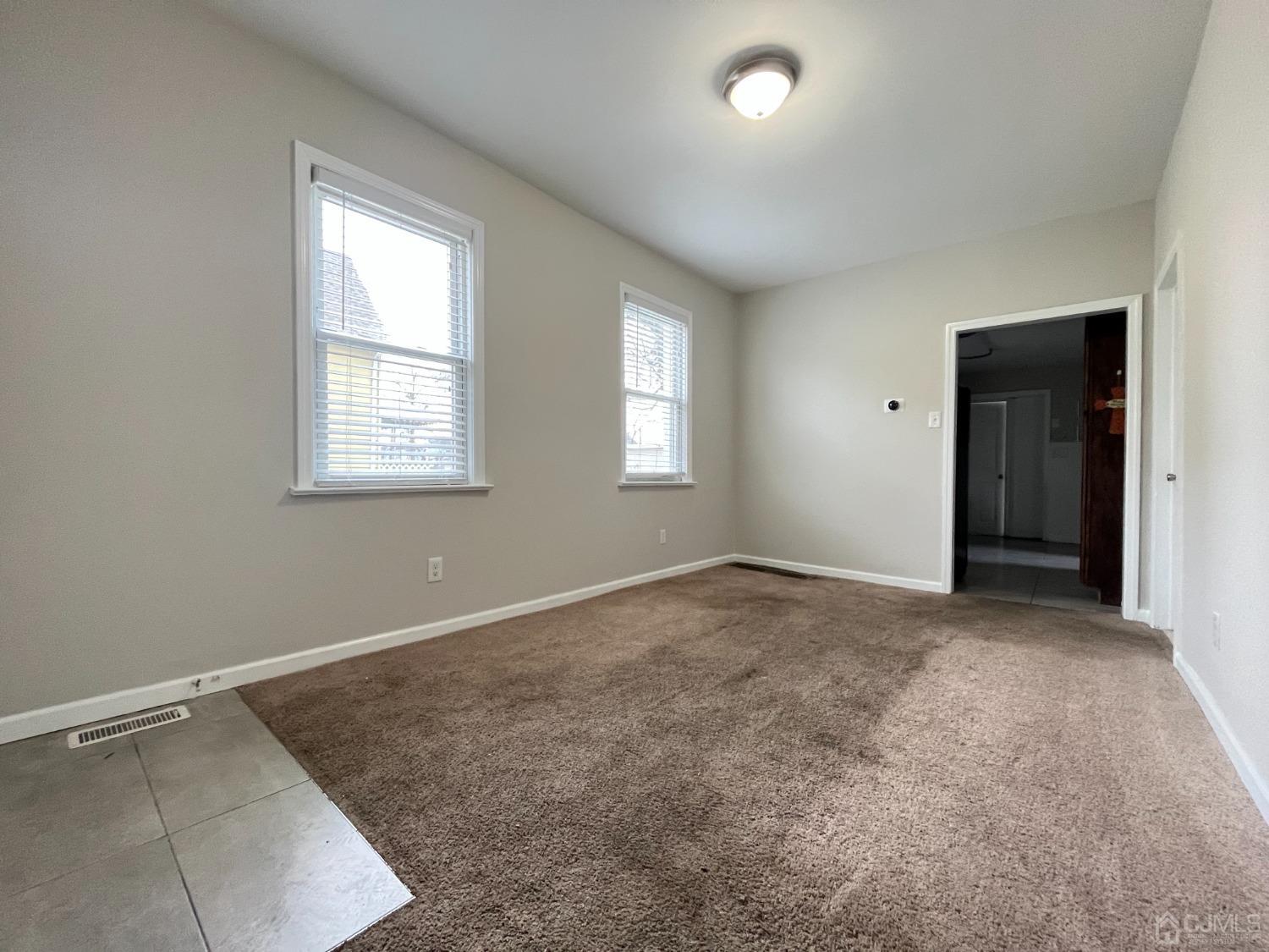 37 Thomas Street Perth Amboy, NJ 08861 - Photo 6 of 30 an empty room with windows