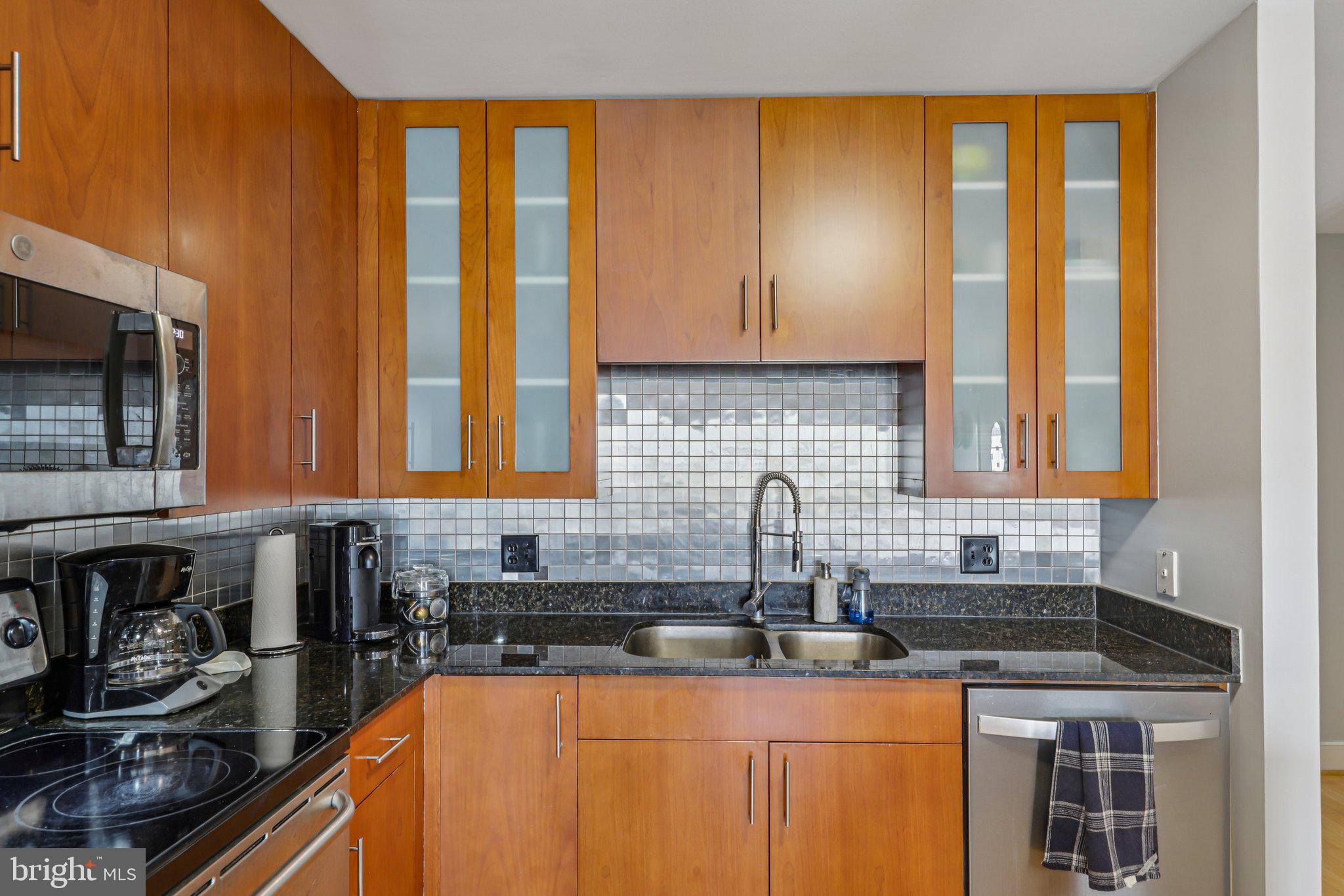 910 M Street Northwest, Unit 918 Washington, DC 20001 - Photo 14 of 44 Granite counters and double sink
