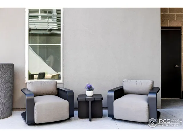 a backyard of a house with outdoor seating